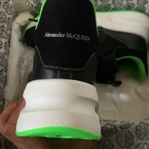 I am selling Alexander McQueens size 11 main color black secondary lime green